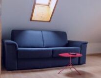 a living room with a couch and a chair